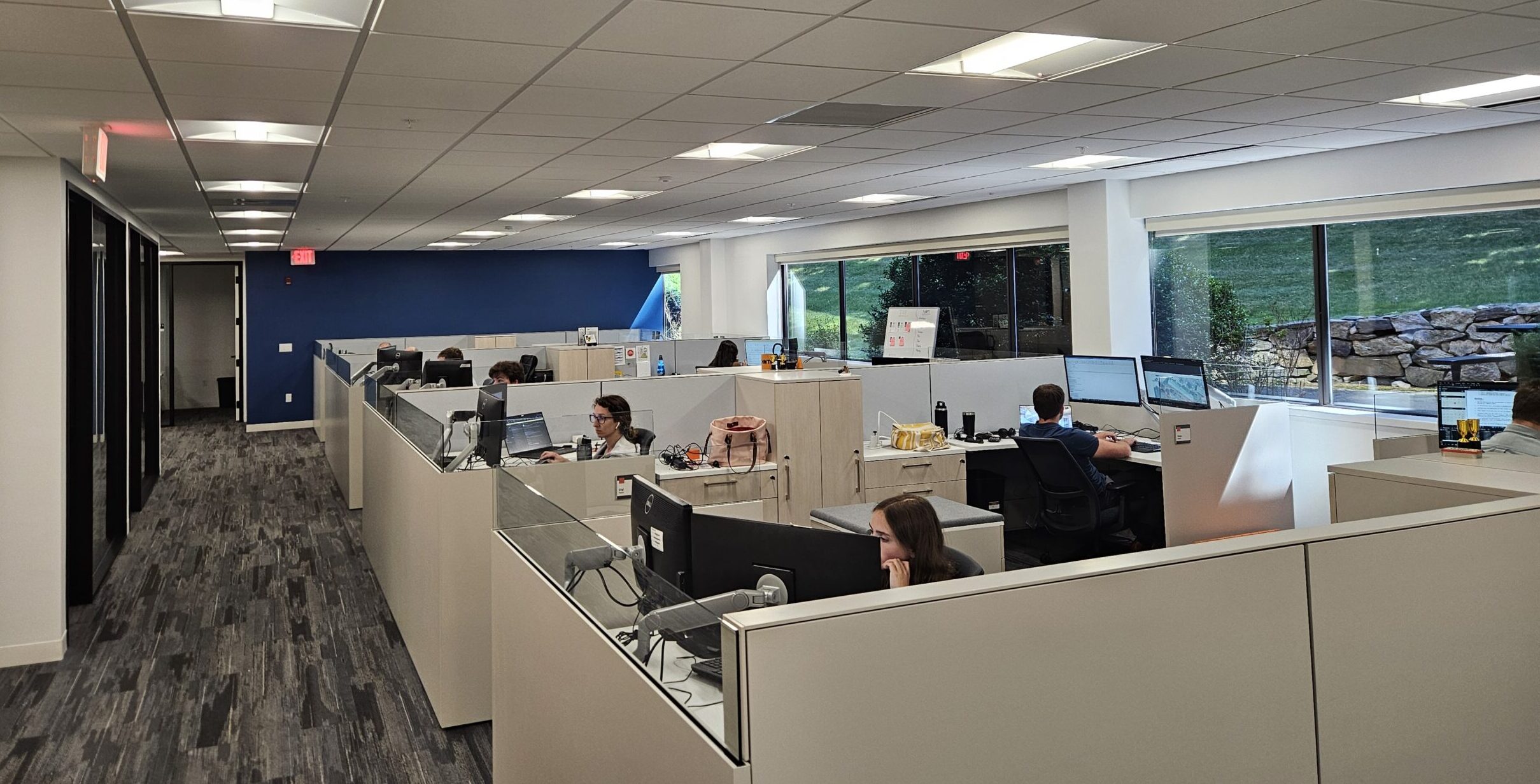 People working at their desks in an office setting